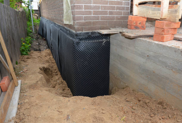 Happy homeowners after waterproofing job in Russellville